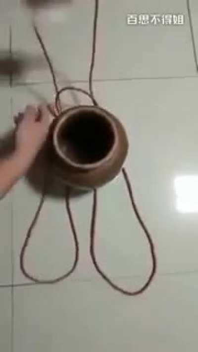 hanging a pot with a rope