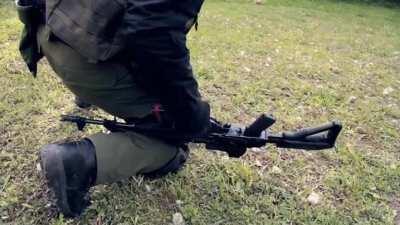 How to reload an AK-47 with an injured arm.