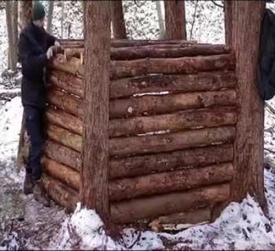 Man builds a house in the middle of the forest