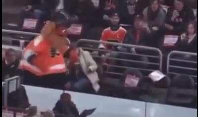 Gritty throws a cake in a fans face, GIF