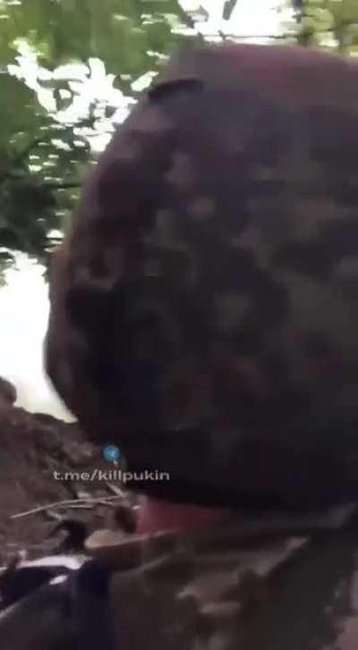 Ukrainian soldiers at work with a German MG3 and helmet