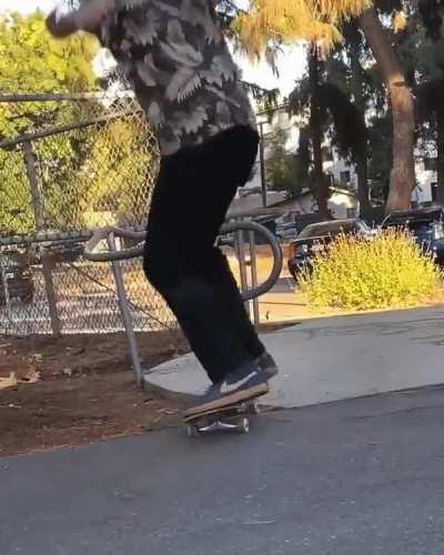 Skateboarder performs smooth kickflip trick