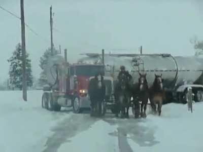 Amish good-samaritan and his team of draft horses pulling a jackknifed tanker truck out of a ditch.