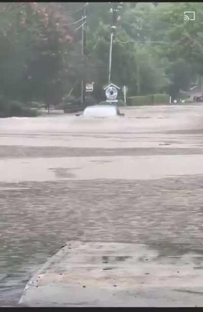 Model S driving through a flooded road