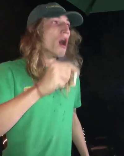 Man chugs 2 beers and projectile vomits while smoking a cigarette