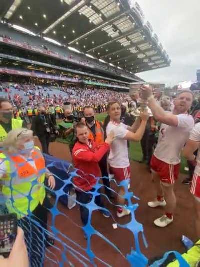 Tyrone players making a fan’s day