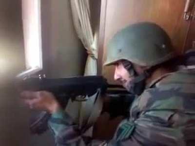 a Close-up of a Syrian Regime soldier being shot in the head by a sniper (Date: ~2013, Location: Unkown)