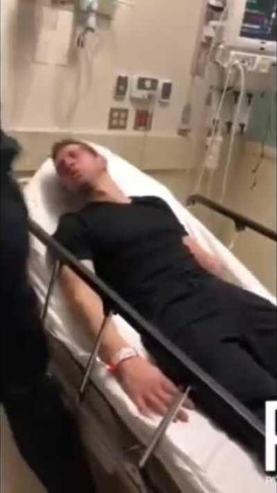 Cop assaults a suicidal man in hospital bed while his donut partner films it.