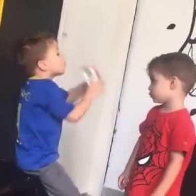 Emptying bottle and giving it to younger brøthër