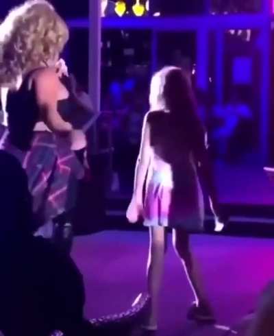 Children being paraded across the stage urging them to pose at a South Beach, Miami drag club in the middle of the night.