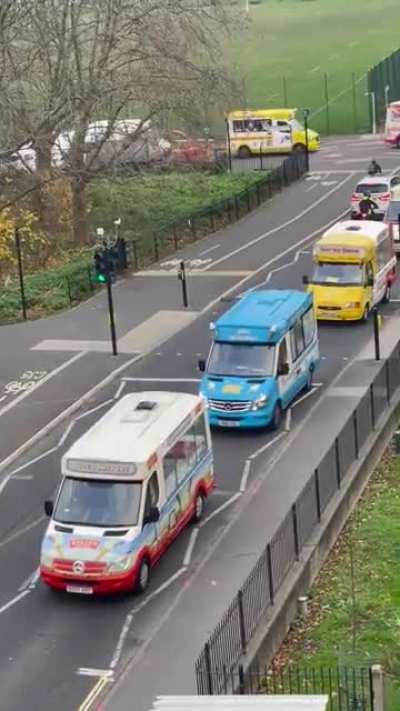 An ice cream man's funeral, with ice cream vans following in solidarity.