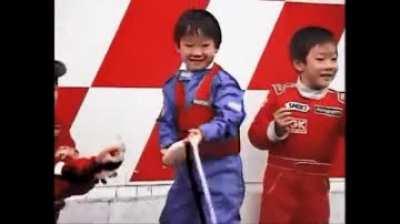 Little Yuki Tsunoda celebrating on podium