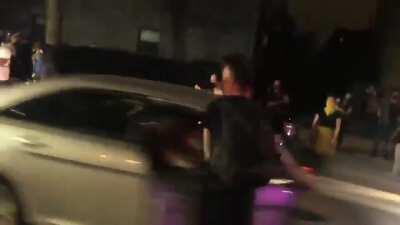 NYPD scum casually knocks over protestor with his car door as he drives by