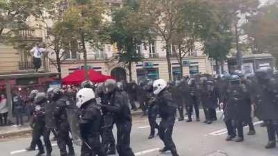 In France, police rush out to the people, expecting them to rush and create a stampede. No one moves and the police are forced to back down