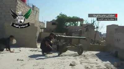 A rebel fighter scores a direct hit on a fast moving BMP with a M60 recoilless gun (Damascus, Syria) [June 2013]