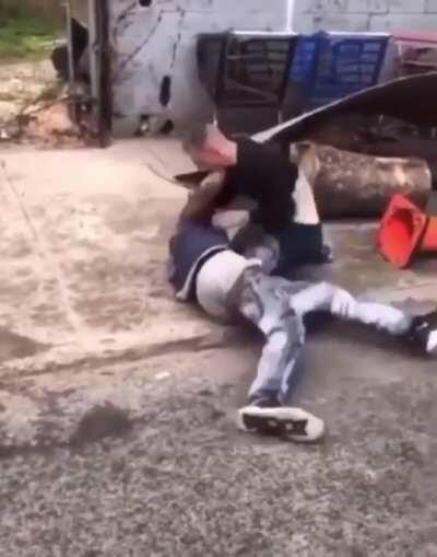 Man grabs a shovel and beats the hell out of 2 guys fighting