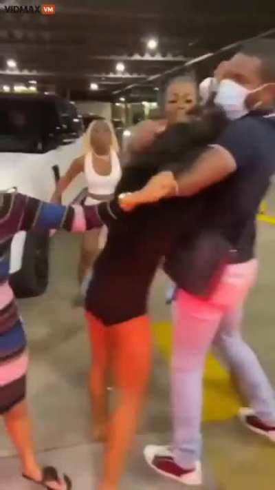 Group of women have a brawl in a parking lot