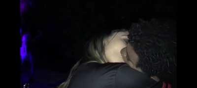 Black brazilian gay guy making out with a girl at a party