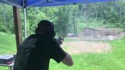 AK-47 muzzle blast deflecting rain