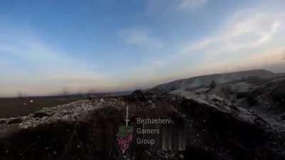 Russian soldiers are trying to storm Ukrainian trenches while being observed and targeted by drones.