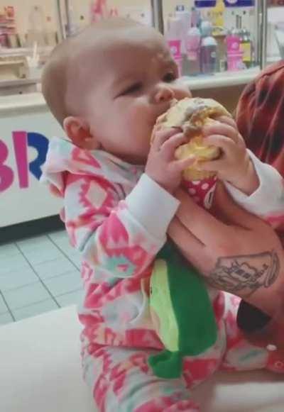 Babies first taste of ice cream.