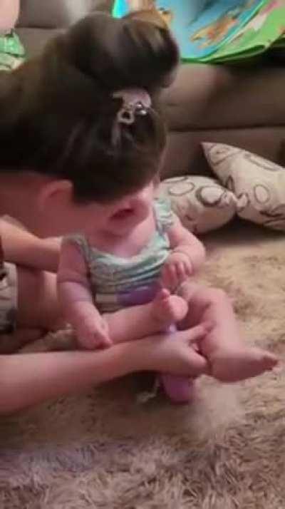 Baby tries a doll scooter