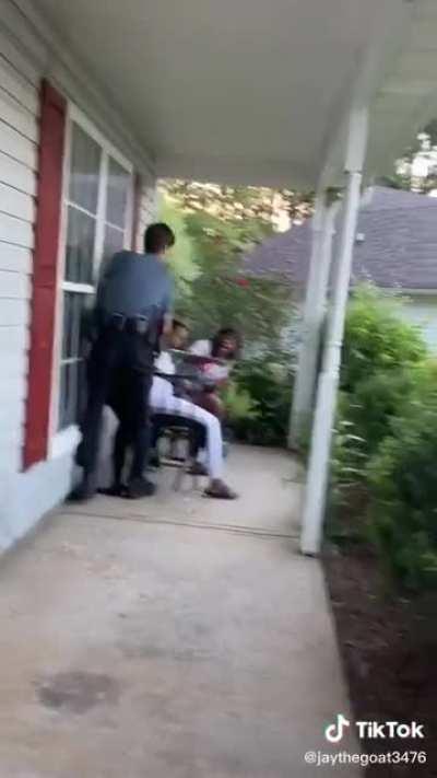 Police drags woman off porch after telling him nobody on the property called for them