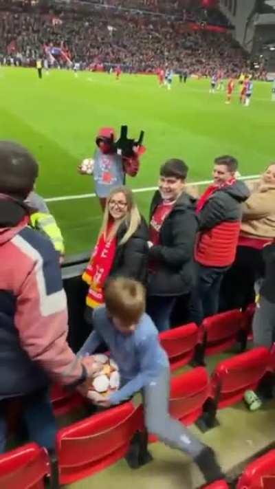 Kid steals the football in the middle of a game