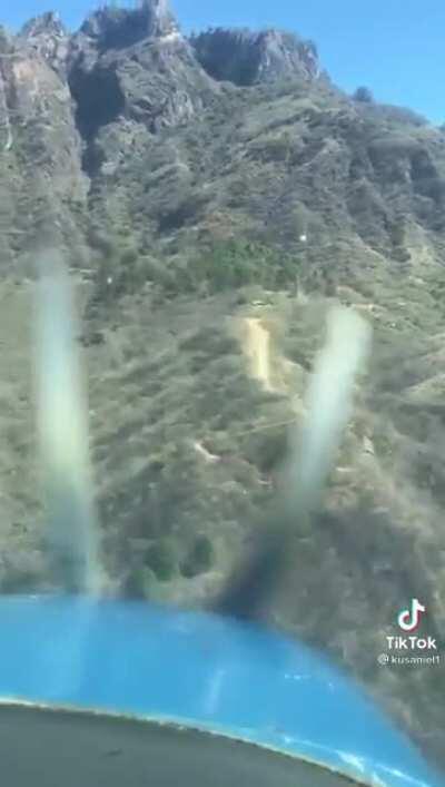 Some sketchy mountain flying, brought to you by Cartel TikTok