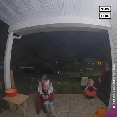 Little boy noticed a house was out of candy on Halloween, so he added some of his own candy to the bowl for the next kids