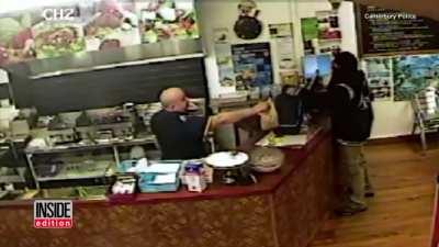 Cashier ignores an armed robber, so the robber leaves