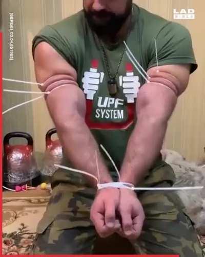 Strong man shows off incredible strength.