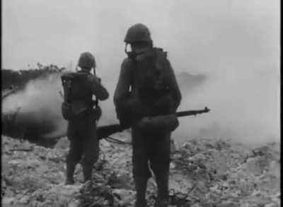 Marines clearing out a bunker shoot a Japanese Soldier trying to escape the flames - Peleliu, 2nd Wave D-DAY