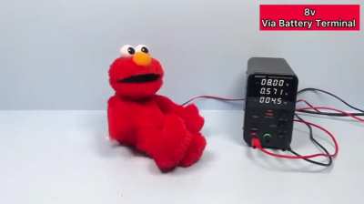 Aaj Elmo toy under increasing voltage