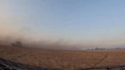 Russian BMP 2 suppressing tree lines in the Kursk area