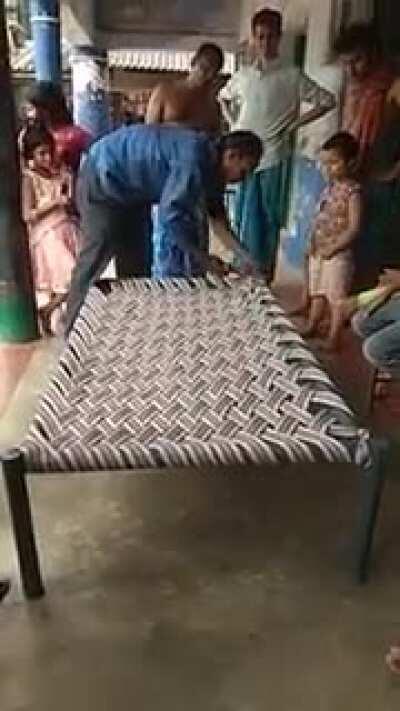 Man weaves a bed