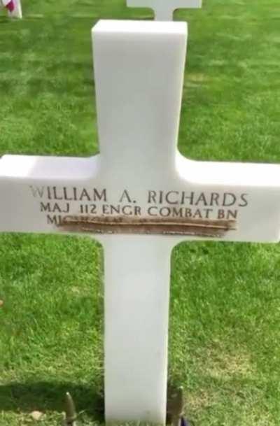 French caretakers take the sand from Omaha Beach and scrub them into the letters to give them the brown/gold coloring.