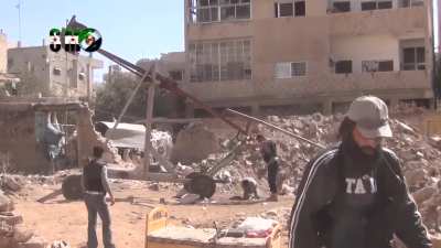 FSA engineers rig a trebuchet to launch anti-tank mines at Syrian Army positions in Daraa - 2014