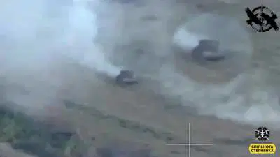 An FPV pilot of the Ukrainian 60th Mechanized Brigade attacks a Russian IFV and the infantry riding it.