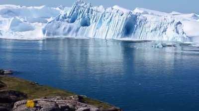 Ilulissat Icefjord - iceberg turning over