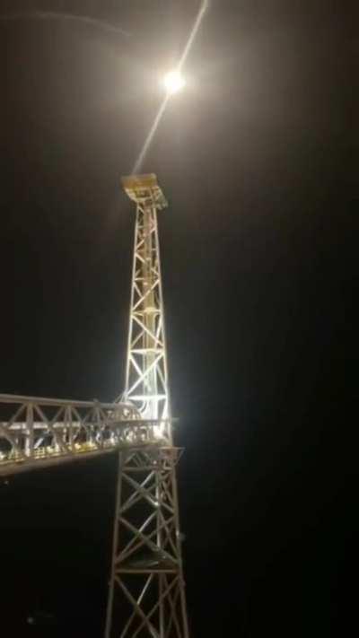 An offshore worker lighting a flare on Equinor’s Sleipner A installation in the North Sea.