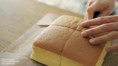 Cutting fresh Castella cake