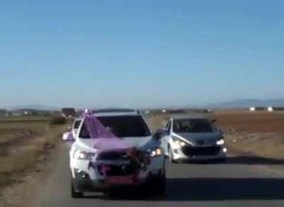 WCGW shooting a flare from a car to celebrate a wedding