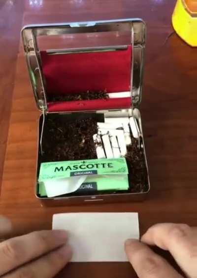 A cigarette rolling case.