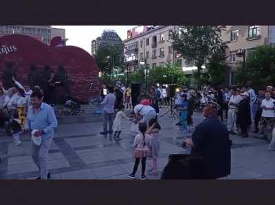 People having good time at street concert.