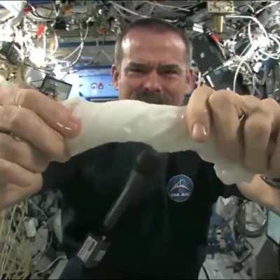 This is what happens when you wring out a wet towel while floating in space.