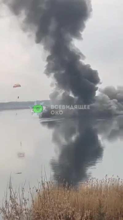 Clear Video of Russian Helicopter shot down and falling into the water near Kiev, one parachute seen.