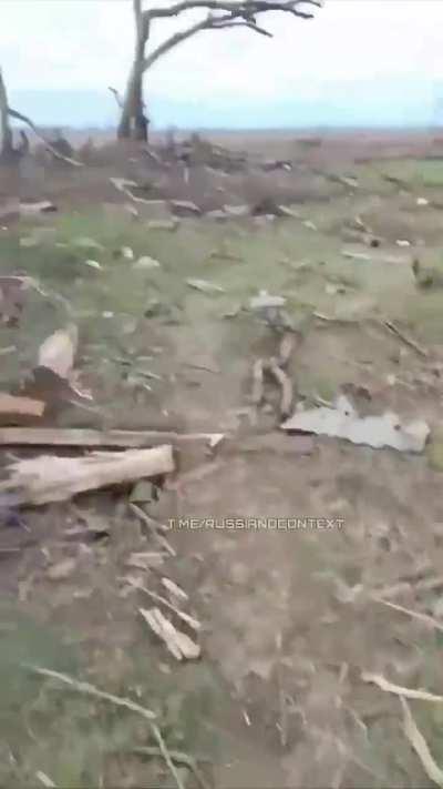 Russian soldier records video in no man's land, showing all the dead Russians from previous failed assaults, some corpses with nothing but bone left. Smells like death.