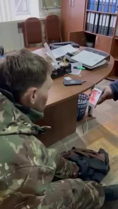 In better terms a captured Russian soldier forced to go to war with his brothers in Ukraine. He is allowed to face time his mum. He tells her where he is. Very sad if I'm honest about the situation. These guys are simply humans.