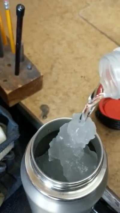 Pouring ice into a Thermos